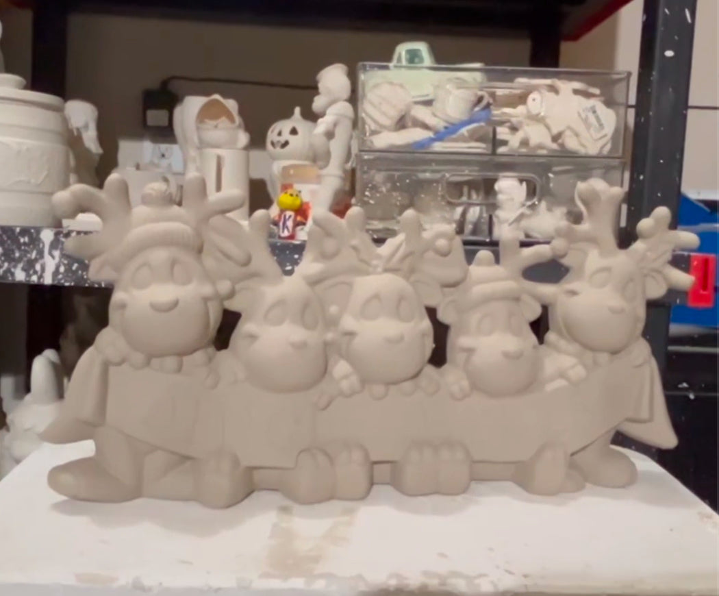 Reindeer with “Jingle Bells” Banner Bisque